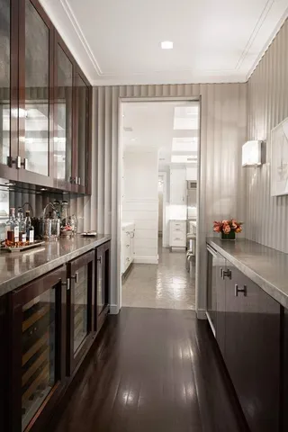 a kitchen with stainless steel appliances a sink dishwasher stove and cabinets