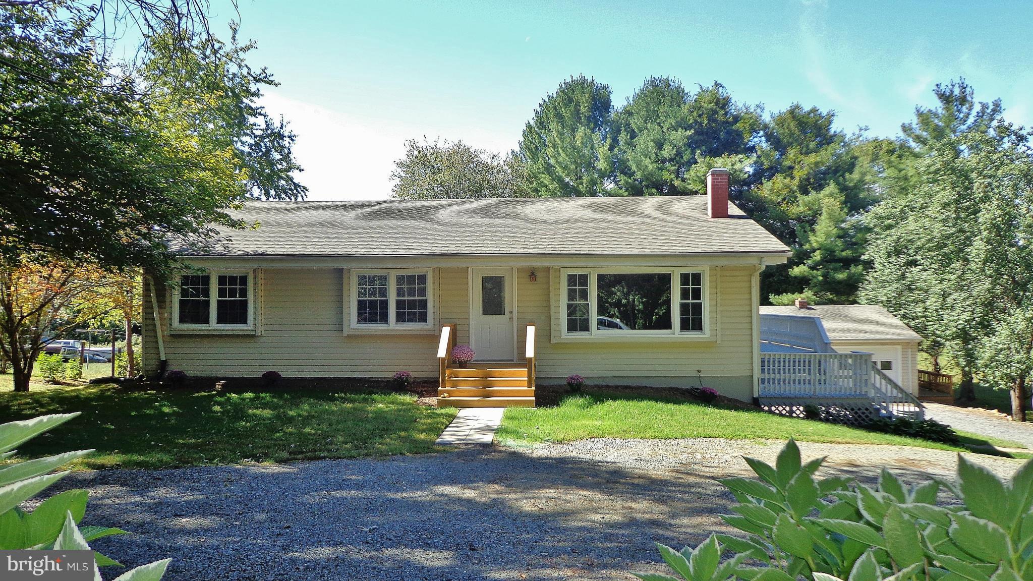 16286 Oak Shade Road Rixeyville, VA 22737 - Photo 1 of 24 a front view of a house with garden