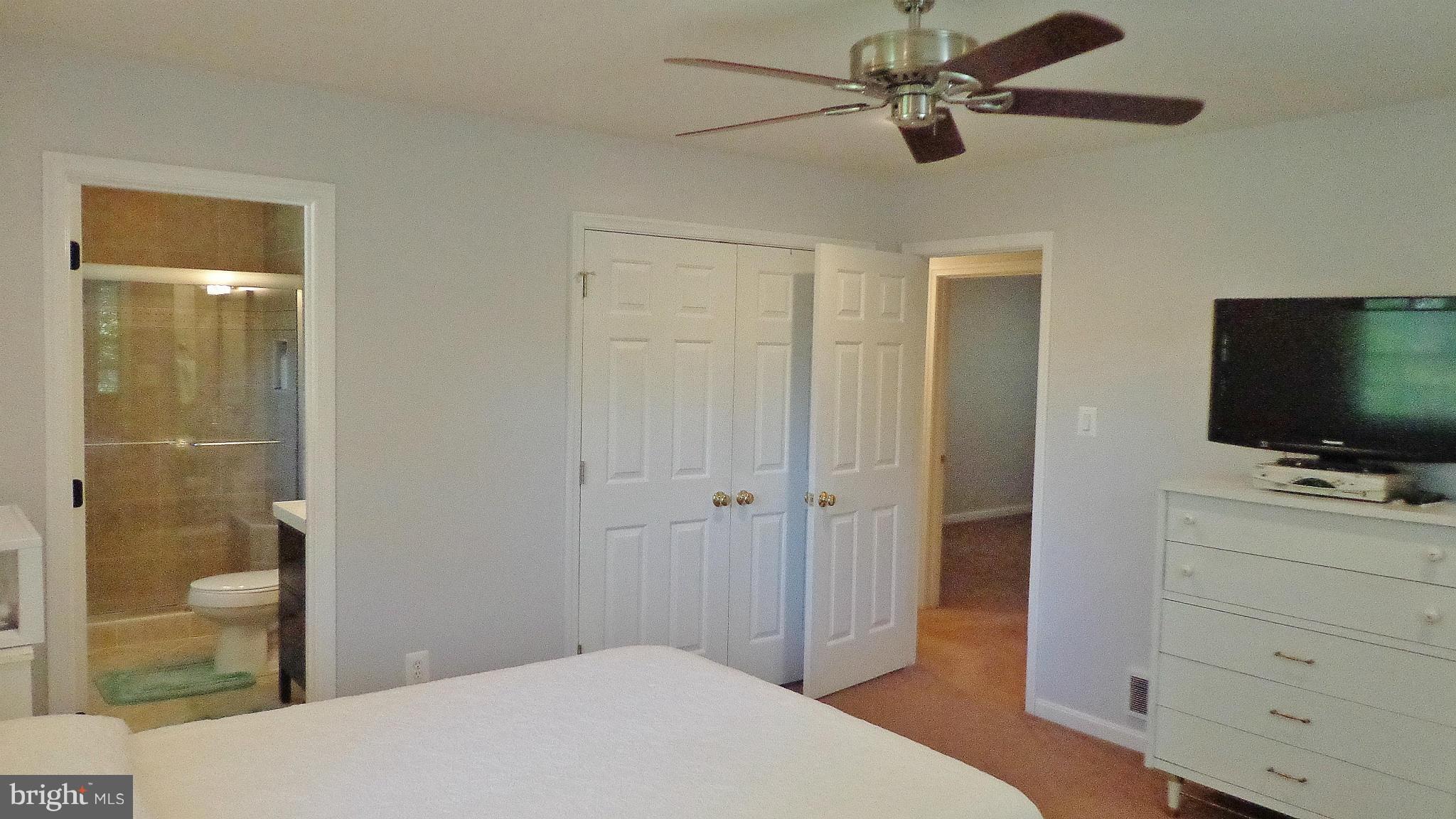 16286 Oak Shade Road Rixeyville, VA 22737 - Photo 12 of 24 a bedroom with a bed and a flat tv screen on dresser
