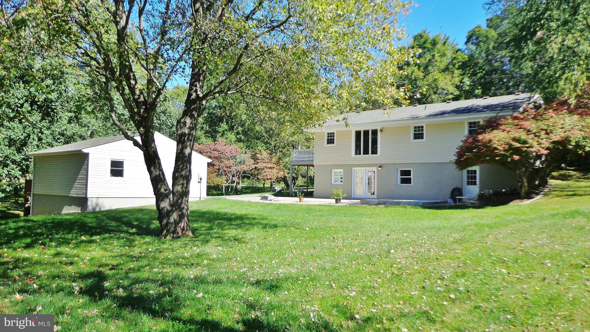 16286 Oak Shade Road Rixeyville, VA 22737 - Photo 4 of 24 a view of a house with backyard and garden