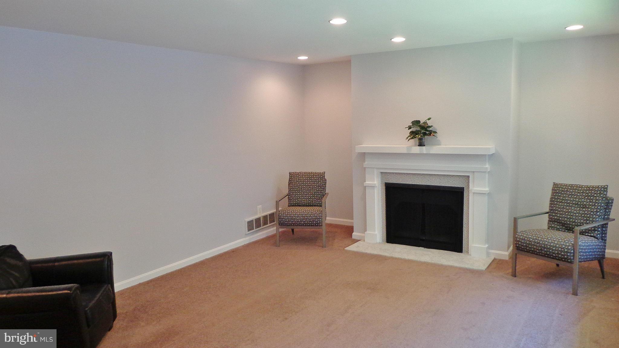 16286 Oak Shade Road Rixeyville, VA 22737 - Photo 8 of 24 a living room with furniture and a fireplace