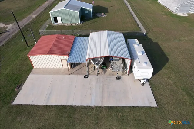 an aerial view of a house with swimming pool