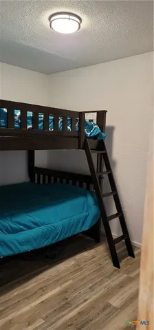 a view of cabinets and wooden floor