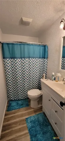 a view of a big room with wooden walls