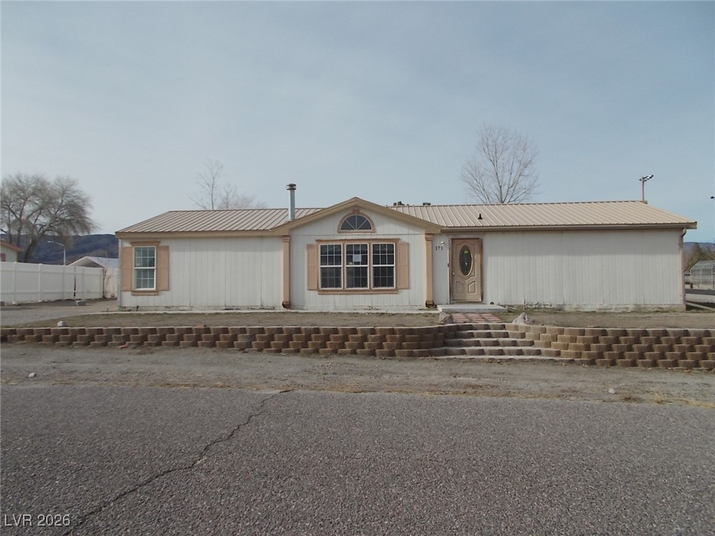 171 Paradise Road Alamo, NV 89001 - Photo 1 of 21 View of front of home featuring a metal roof