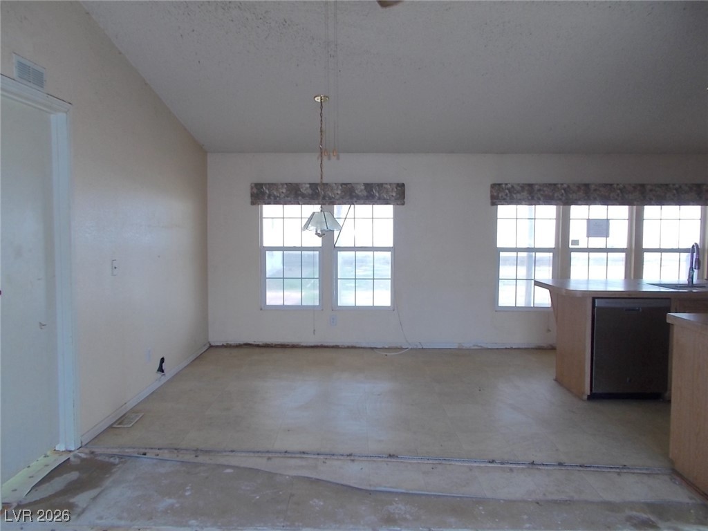 171 Paradise Road Alamo, NV 89001 - Photo 5 of 21 Unfurnished dining area featuring unfinished concrete flooring and a sink