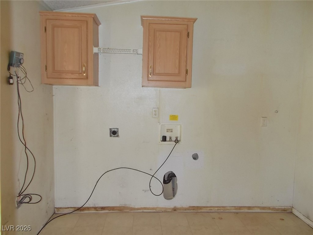 171 Paradise Road Alamo, NV 89001 - Photo 8 of 21 Laundry area featuring hookup for an electric dryer, hookup for a washing machine, cabinet space, and light flooring