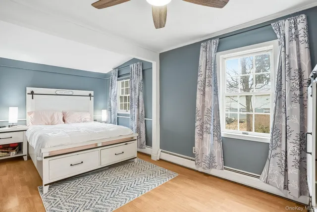 a bedroom with a large bed and a window