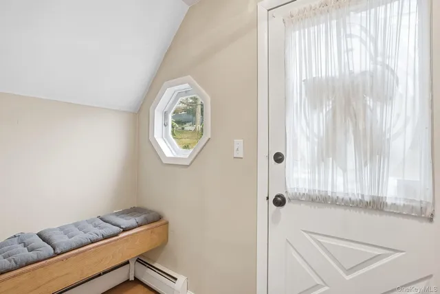 a room with a bed and a window