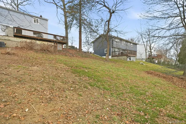 a view of a yard with snow on the road
