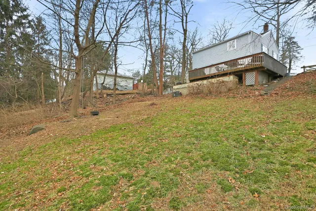 a house that has a tree in front of it