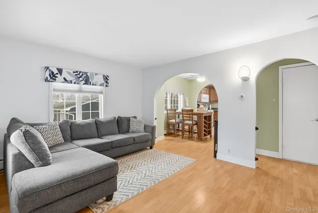 a living room with furniture windows and a large window