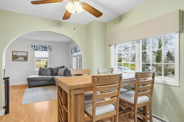 a view of a dining room with furniture window and wooden floor