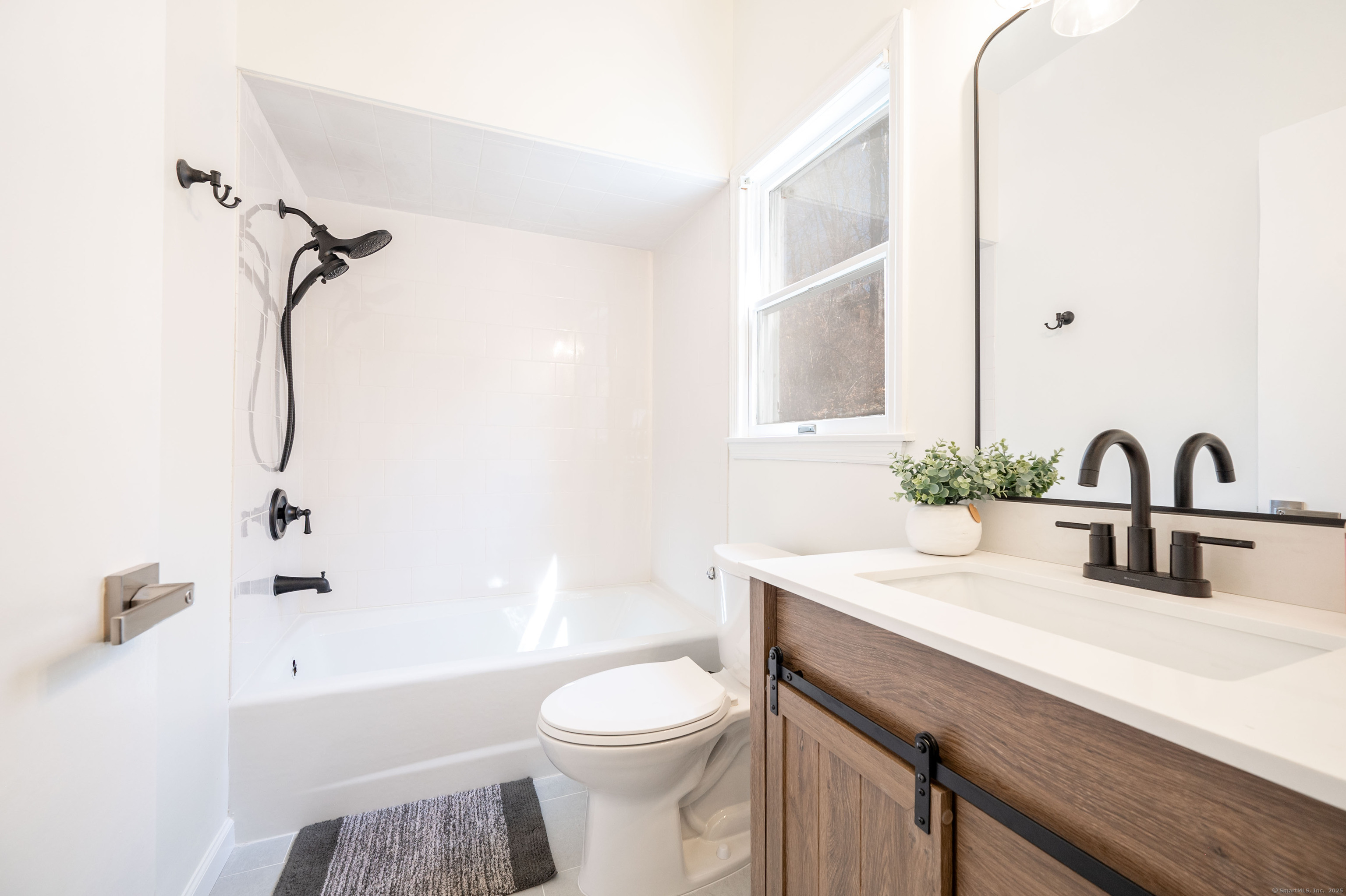 20 Musnug Road Danbury, CT 06811 - Photo 16 of 39 a bathroom with a sink a toilet and a bathtub