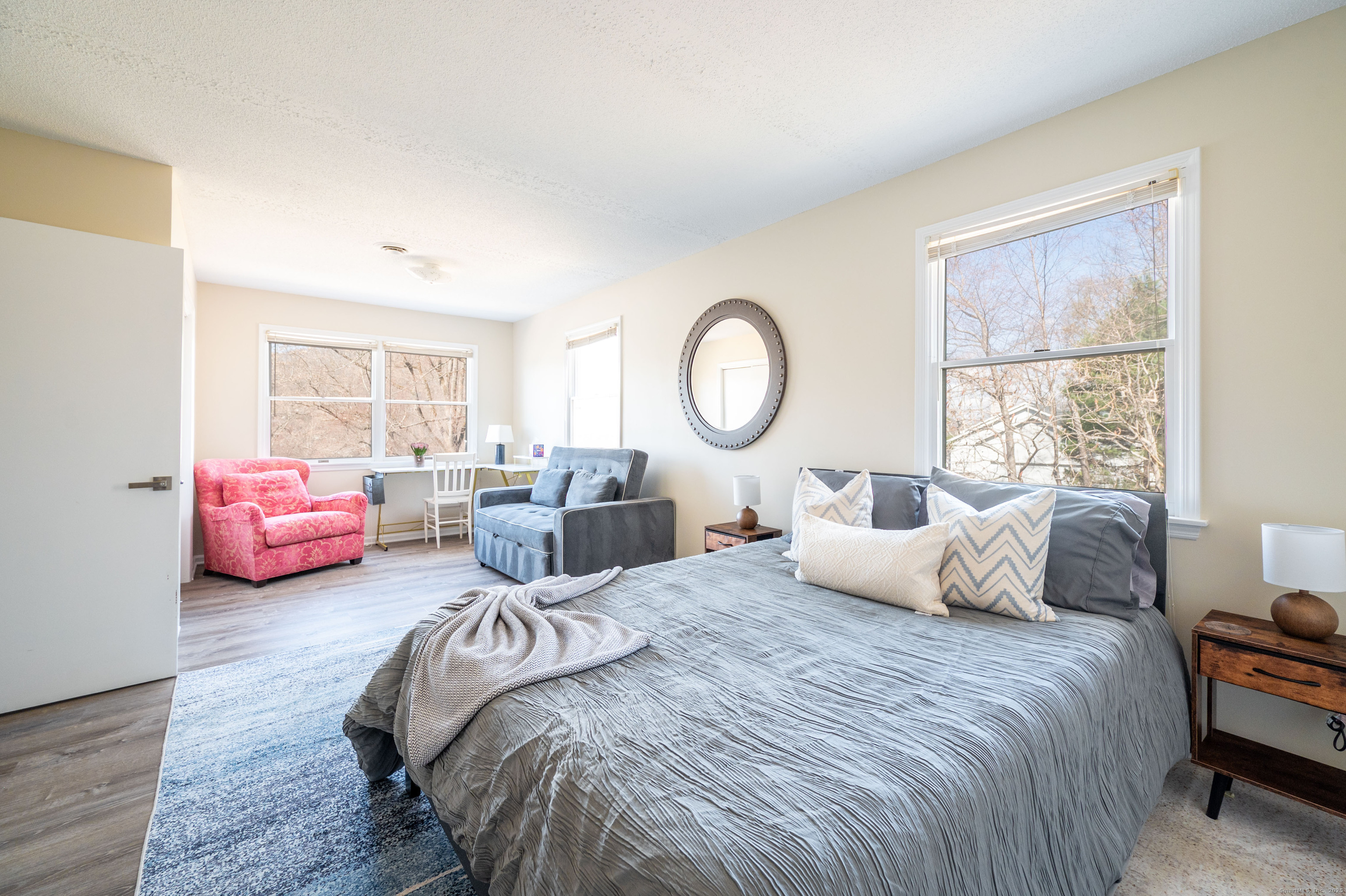20 Musnug Road Danbury, CT 06811 - Photo 19 of 39 a bedroom with bed a couch and dresser next to a window