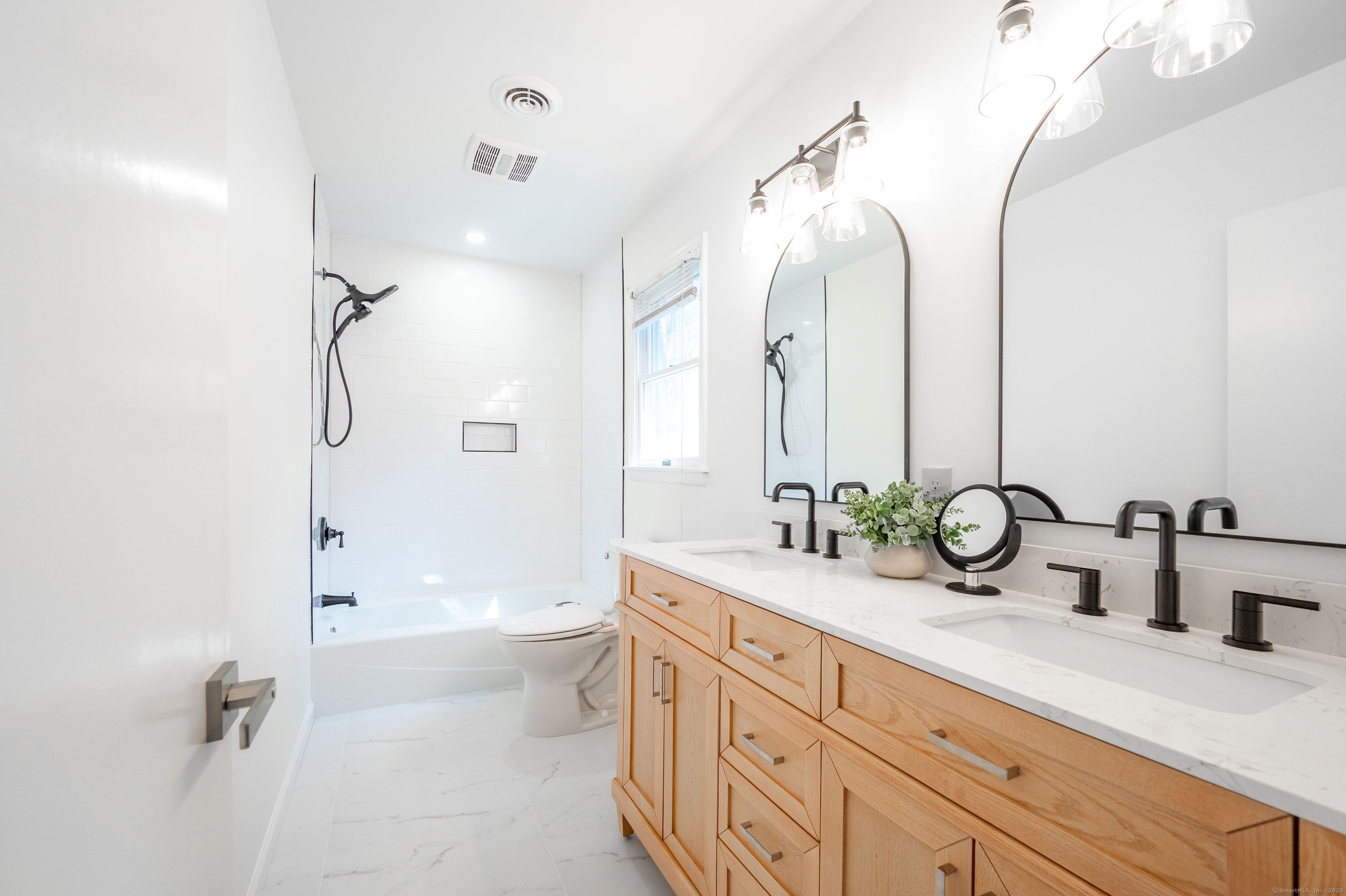 20 Musnug Road Danbury, CT 06811 - Photo 22 of 39 a bathroom with a double vanity sink mirror double and shower