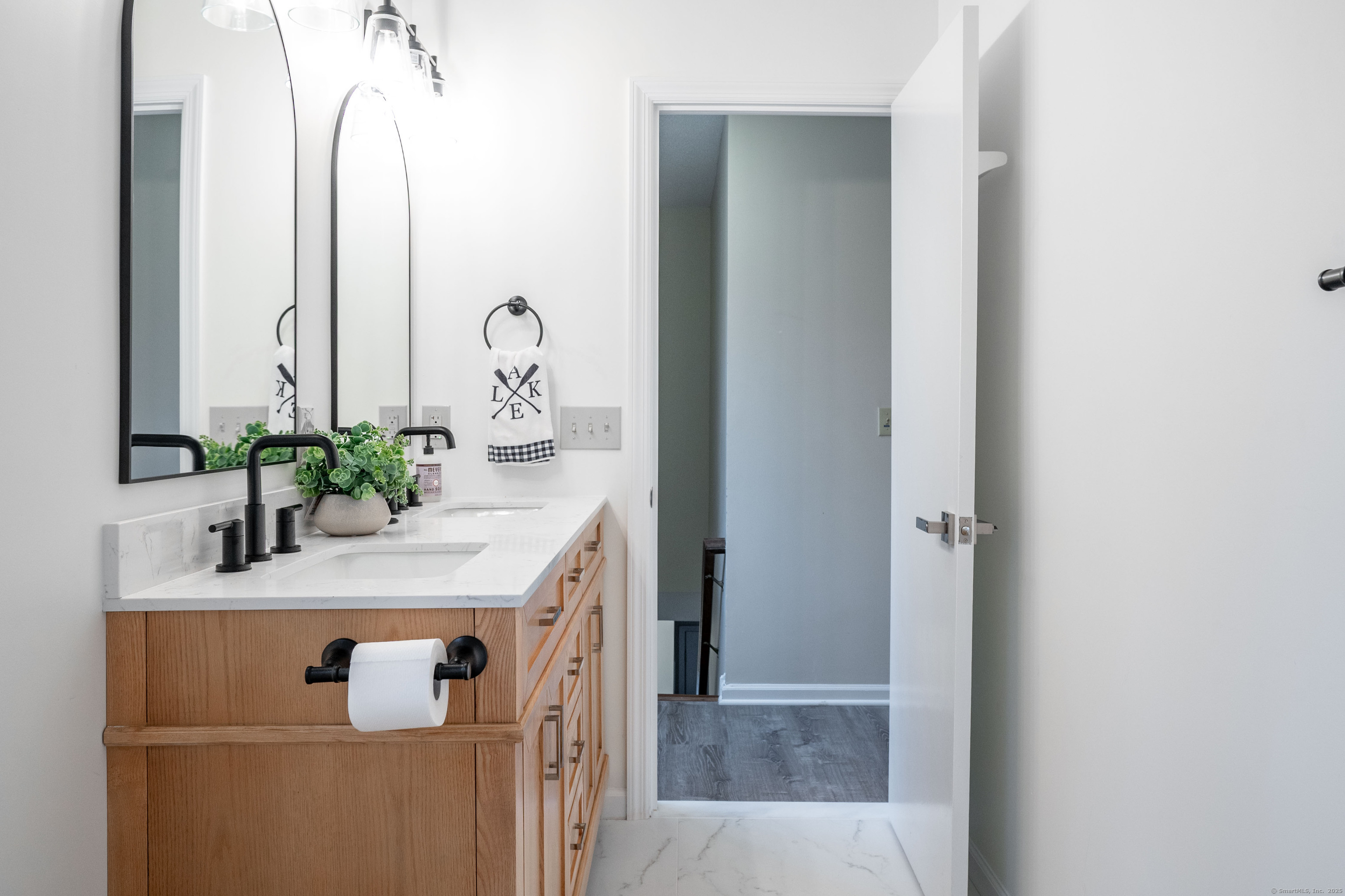 20 Musnug Road Danbury, CT 06811 - Photo 23 of 39 a bathroom with a granite countertop sink and a mirror