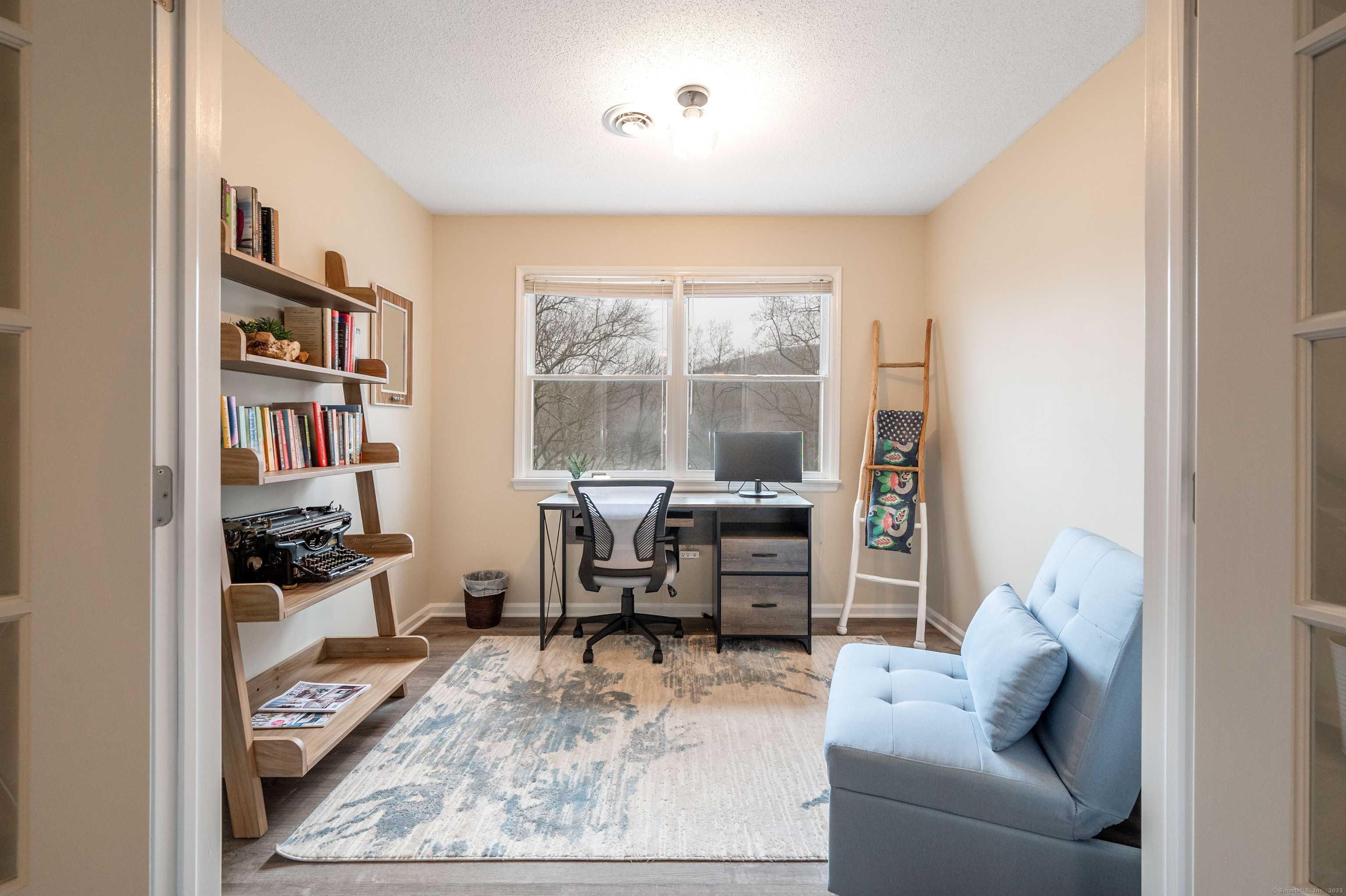 20 Musnug Road Danbury, CT 06811 - Photo 27 of 39 a living room with furniture and a large window