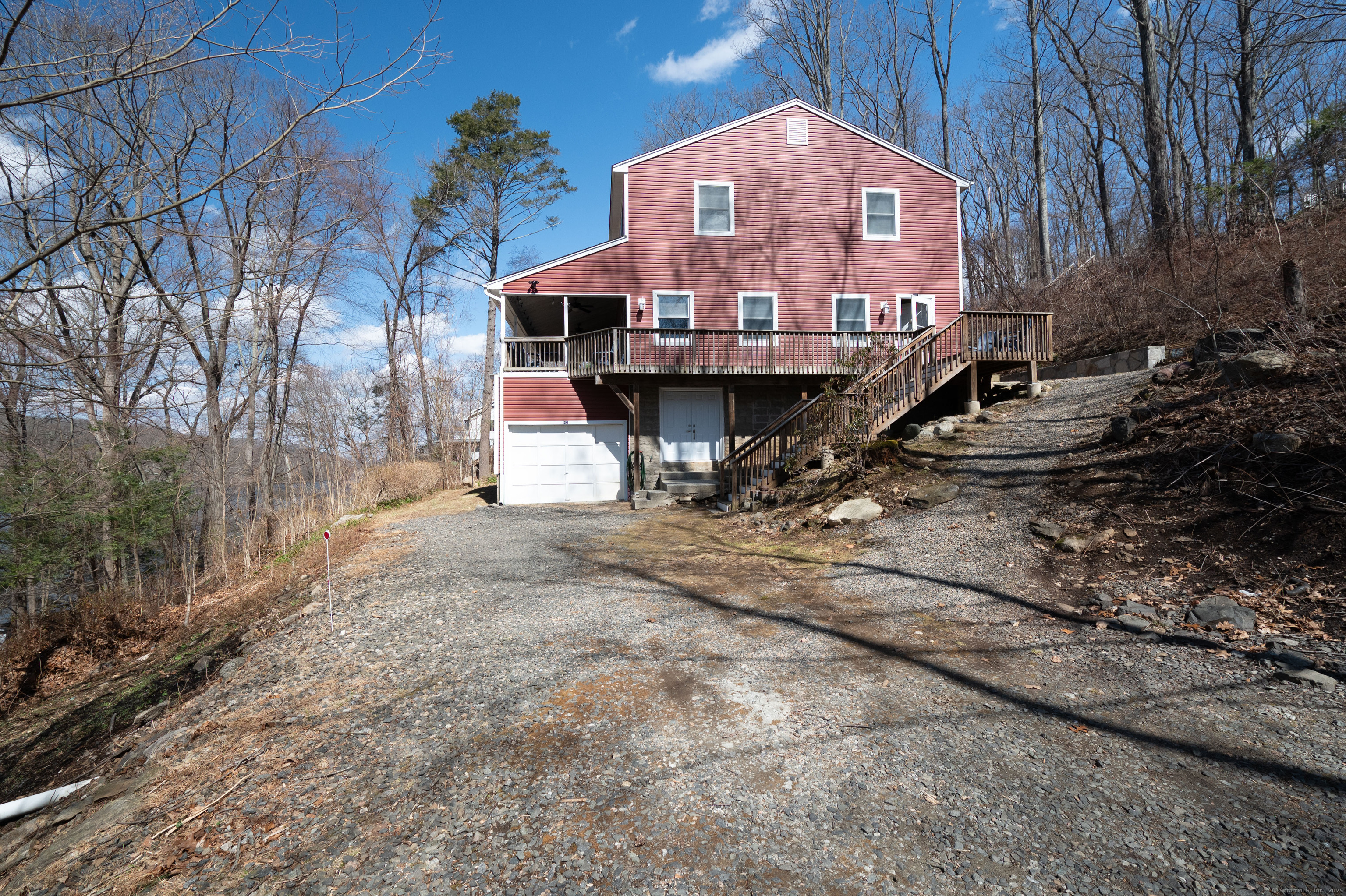 20 Musnug Road Danbury, CT 06811 - Photo 34 of 39 a view of a house with large trees next to a road