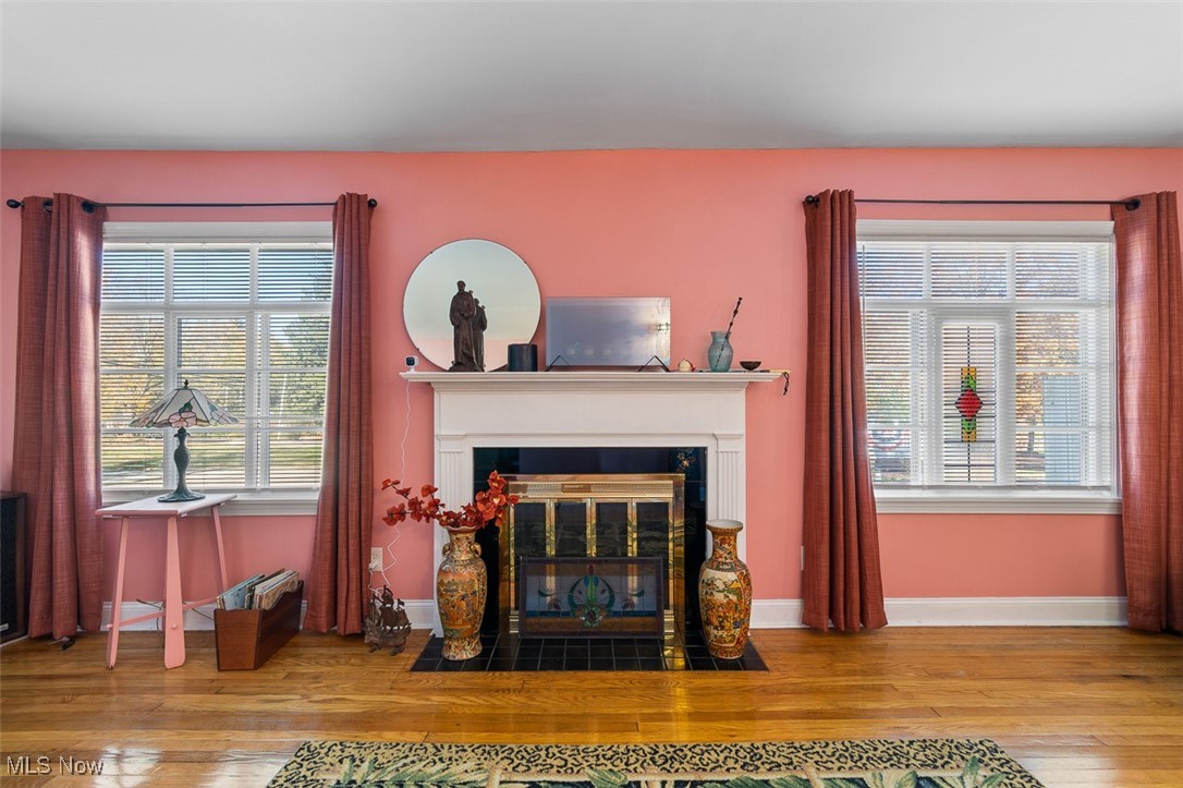 4851 Manchester Road Akron, OH 44319 - Photo 7 of 36 Living area featuring a fireplace with flush hearth and hardwood / wood-style flooring
