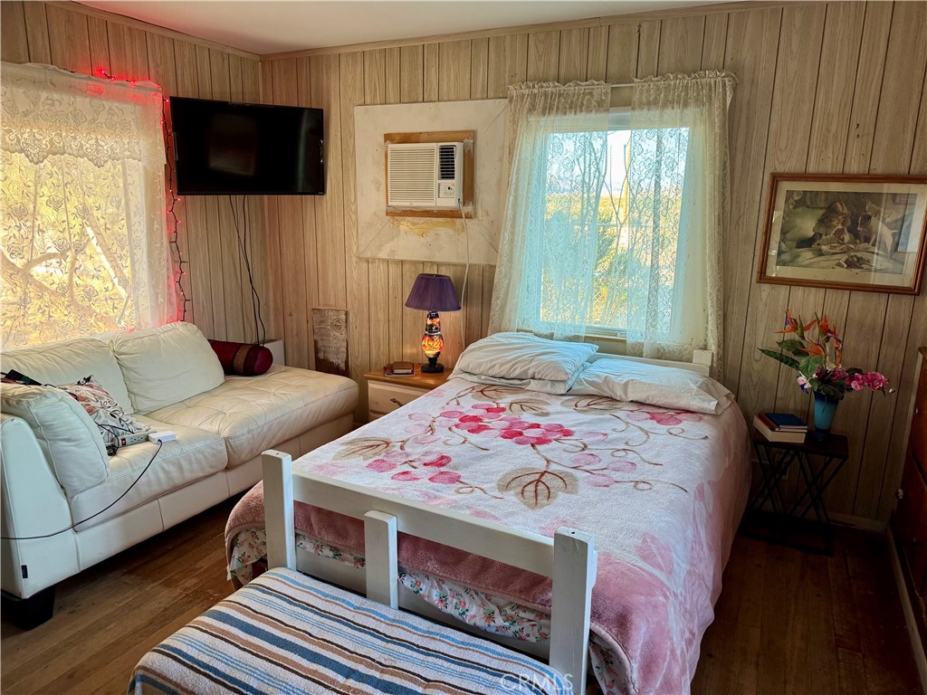 4759 Pinto Mountain Road Twentynine Palms, CA 92277 - Photo 13 of 21 a living room with furniture a flat screen tv and a fireplace