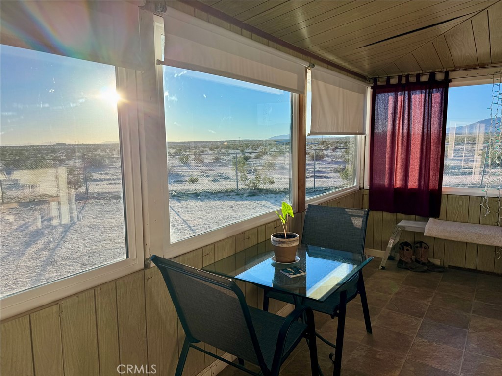 4759 Pinto Mountain Road Twentynine Palms, CA 92277 - Photo 10 of 21 a living room with a table and chairs