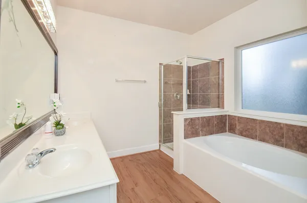 a bathroom with a bathtub and a sink