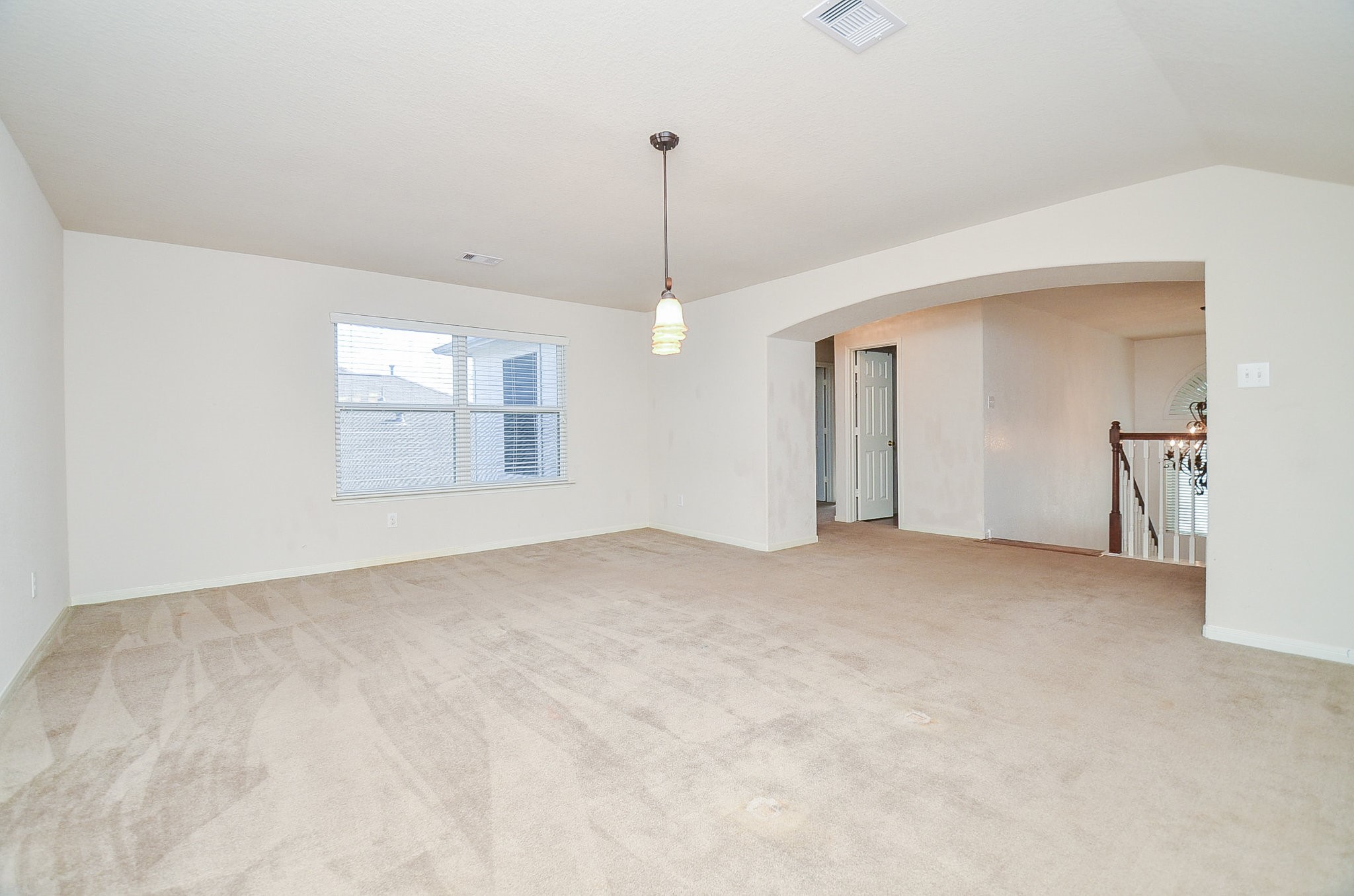 3003 Sage Grouse Court Rosenberg, TX 77471 - Photo 23 of 34 a view of an empty room with chandelier and window