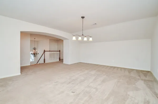 a view of empty room with a ceiling fan