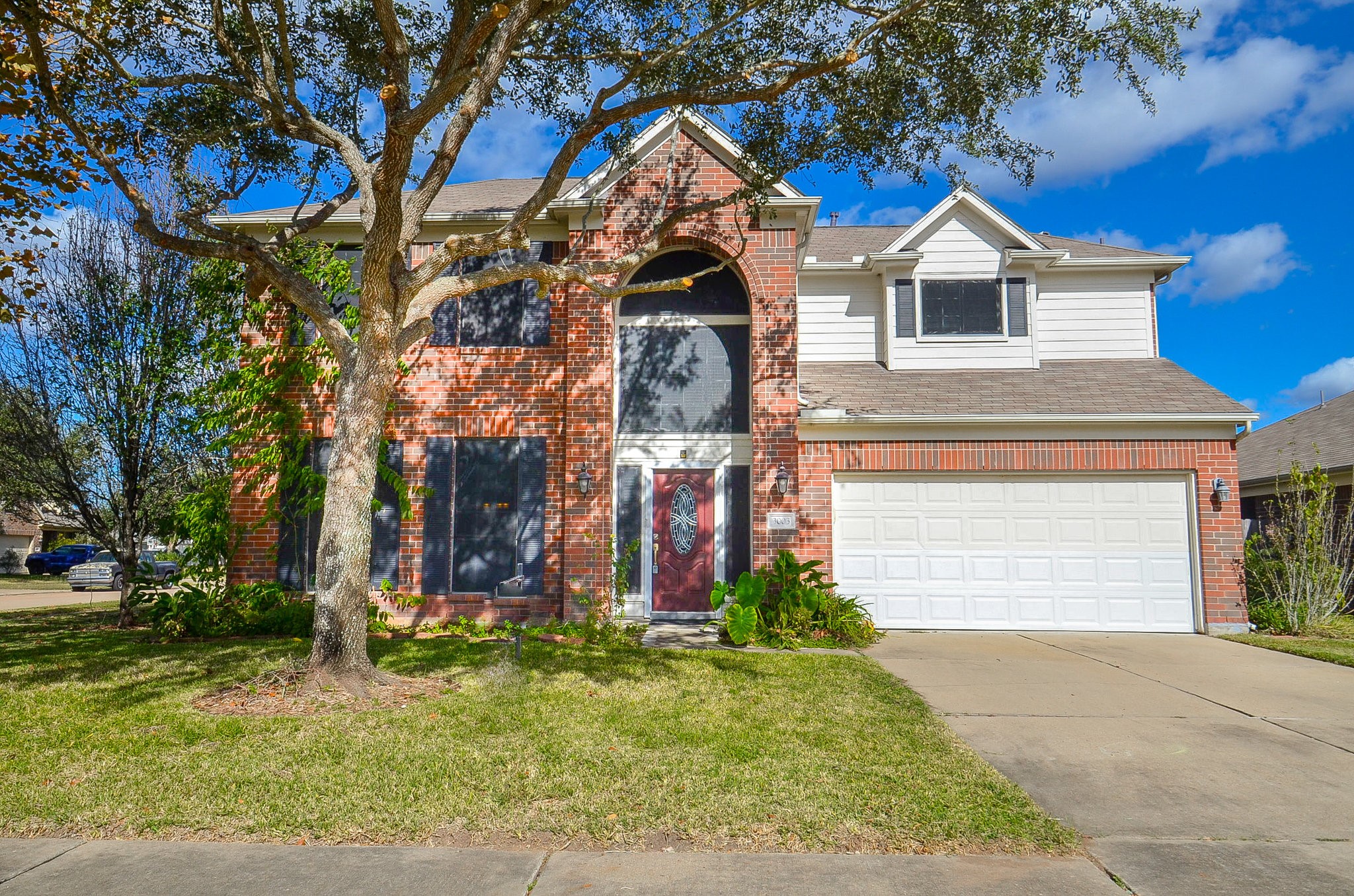 3003 Sage Grouse Court Rosenberg, TX 77471 - Photo 29 of 34 a front view of a house with garden