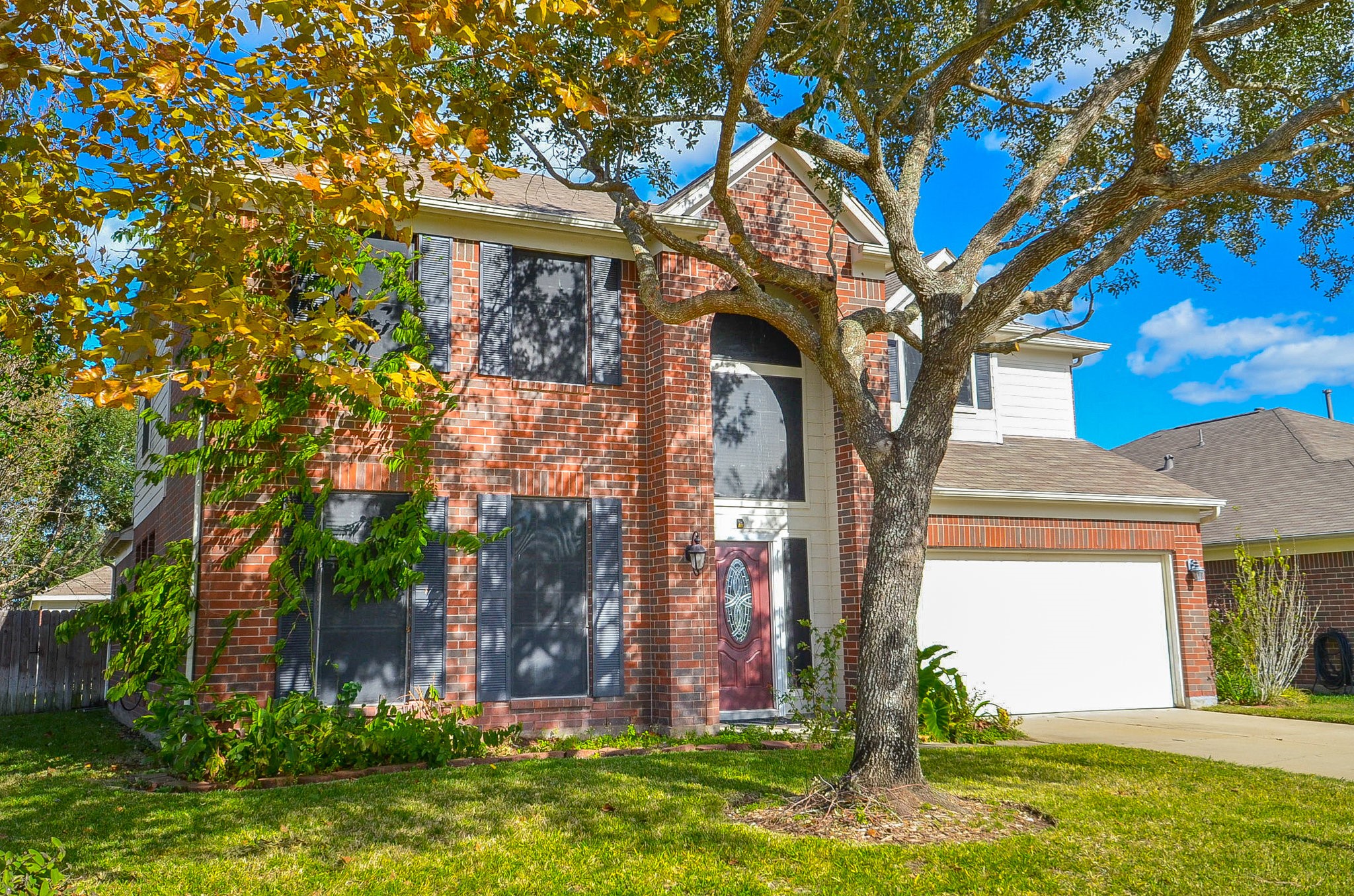 3003 Sage Grouse Court Rosenberg, TX 77471 - Photo 30 of 34 a front view of a house with garden