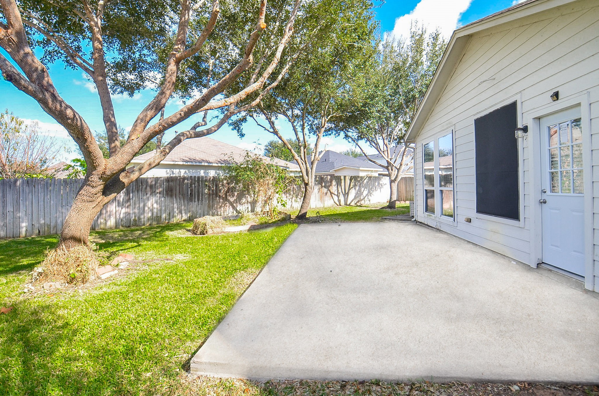 3003 Sage Grouse Court Rosenberg, TX 77471 - Photo 33 of 34 a view of a house with backyard and tree