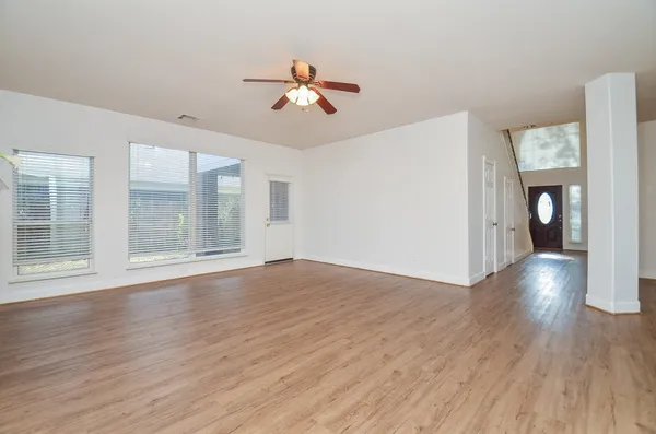 a view of livingroom with hardwood floor and ceiling fan