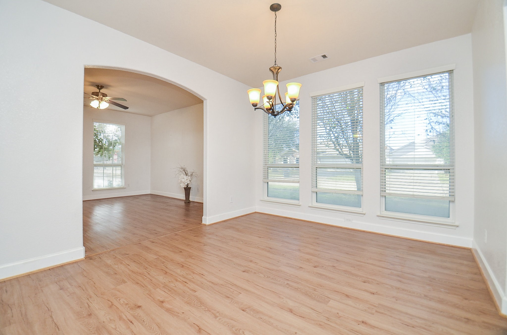 3003 Sage Grouse Court Rosenberg, TX 77471 - Photo 10 of 34 a view of an empty room with wooden floor and a window