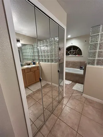 a kitchen with a sink and chairs