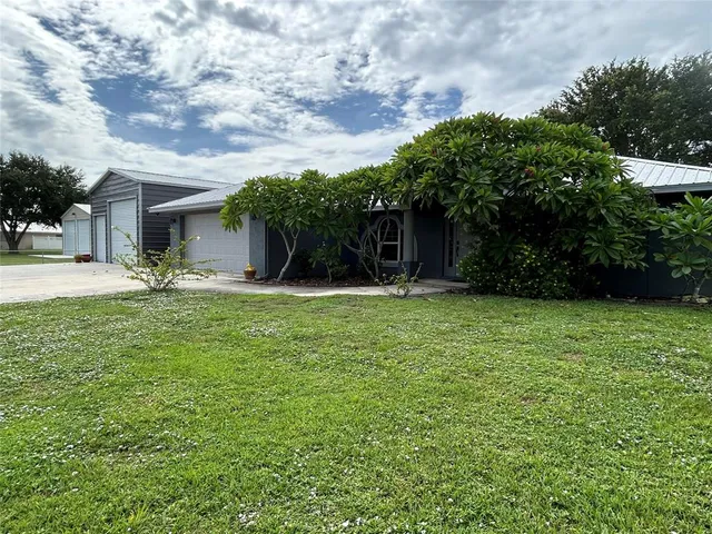 a view of a backyard of the house
