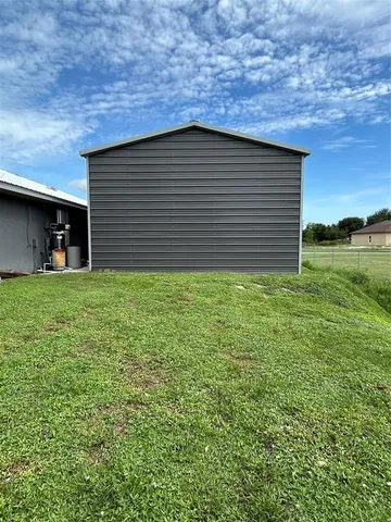 a view of a backyard of the house