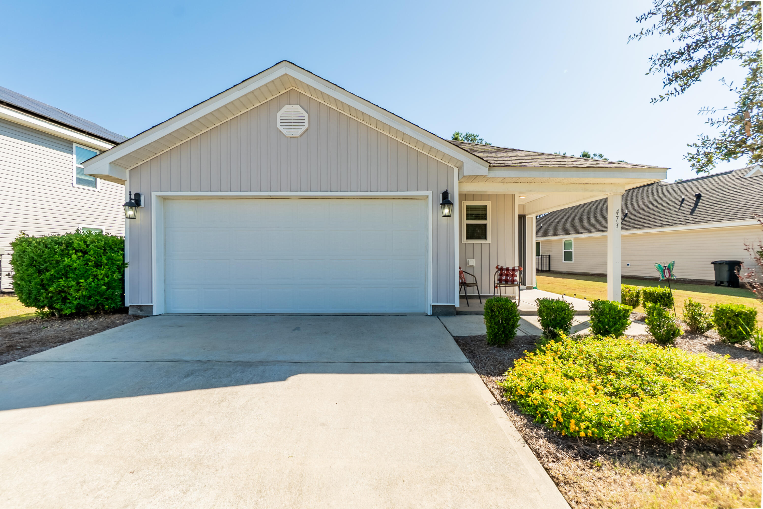 a front view of a house with garden