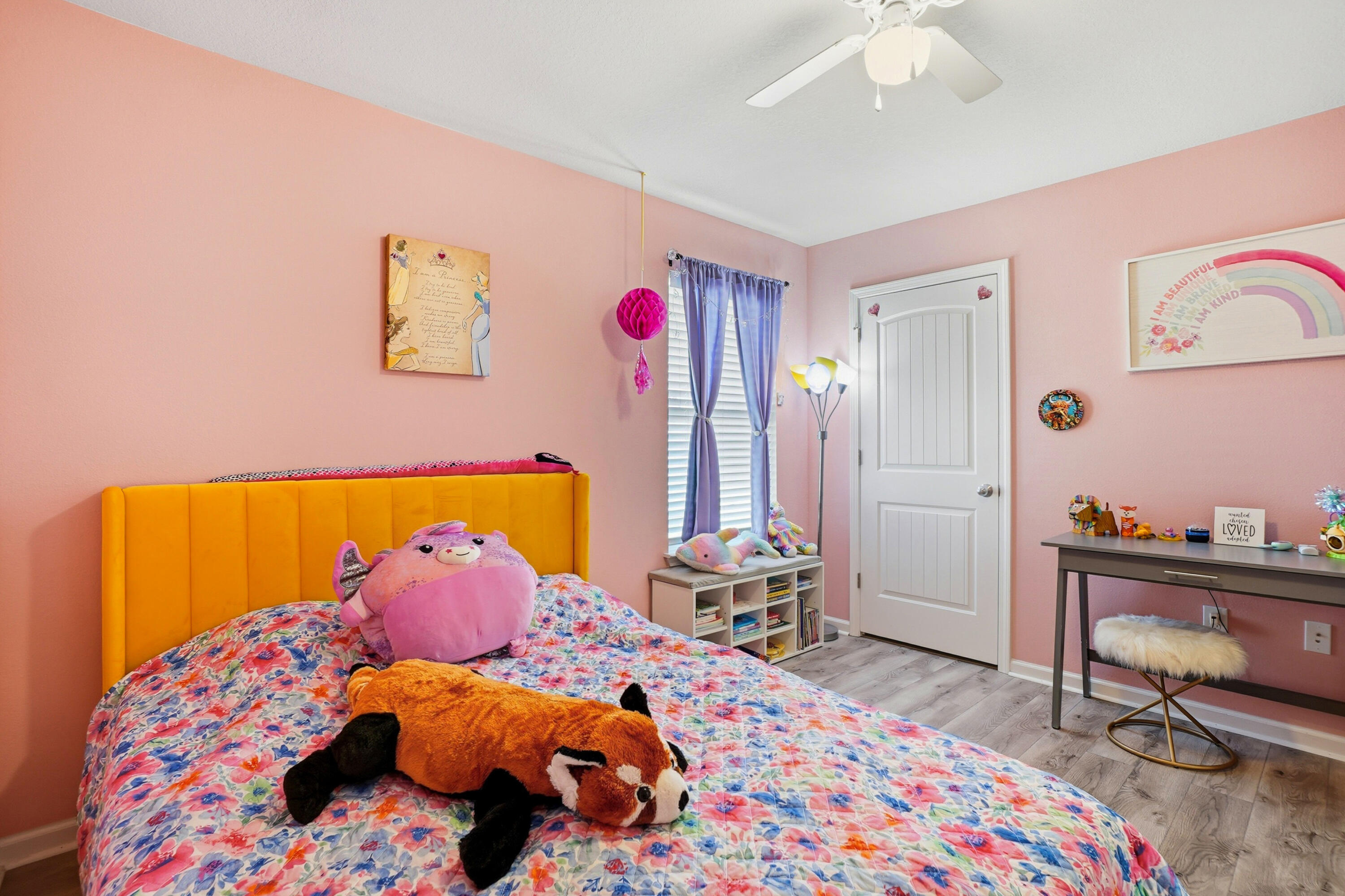 473 Earl Godwin Road Freeport, FL 32439 - Photo 12 of 29 a bedroom with a bed and wooden floor