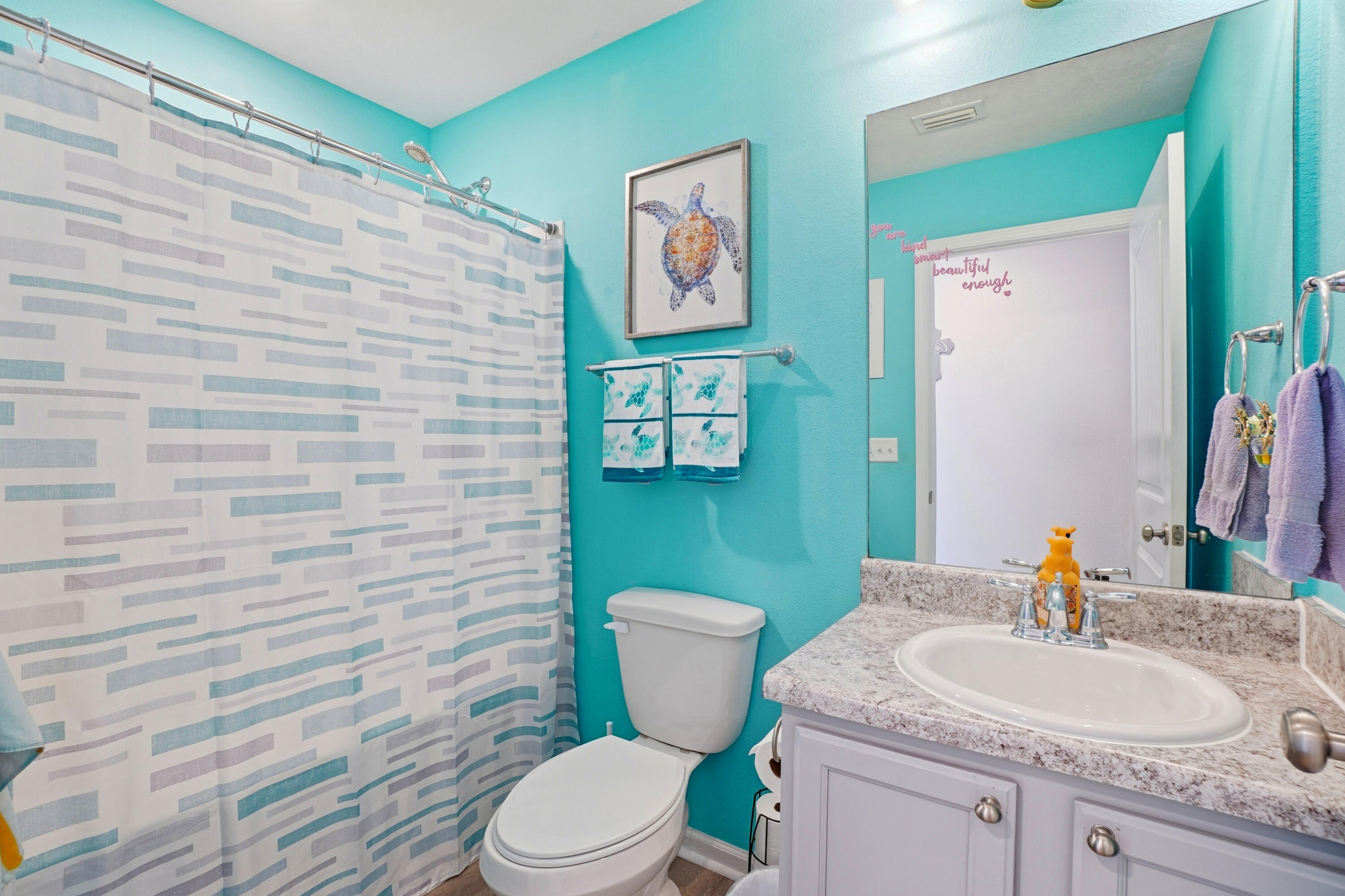 473 Earl Godwin Road Freeport, FL 32439 - Photo 13 of 29 a bathroom with a toilet a sink and mirror