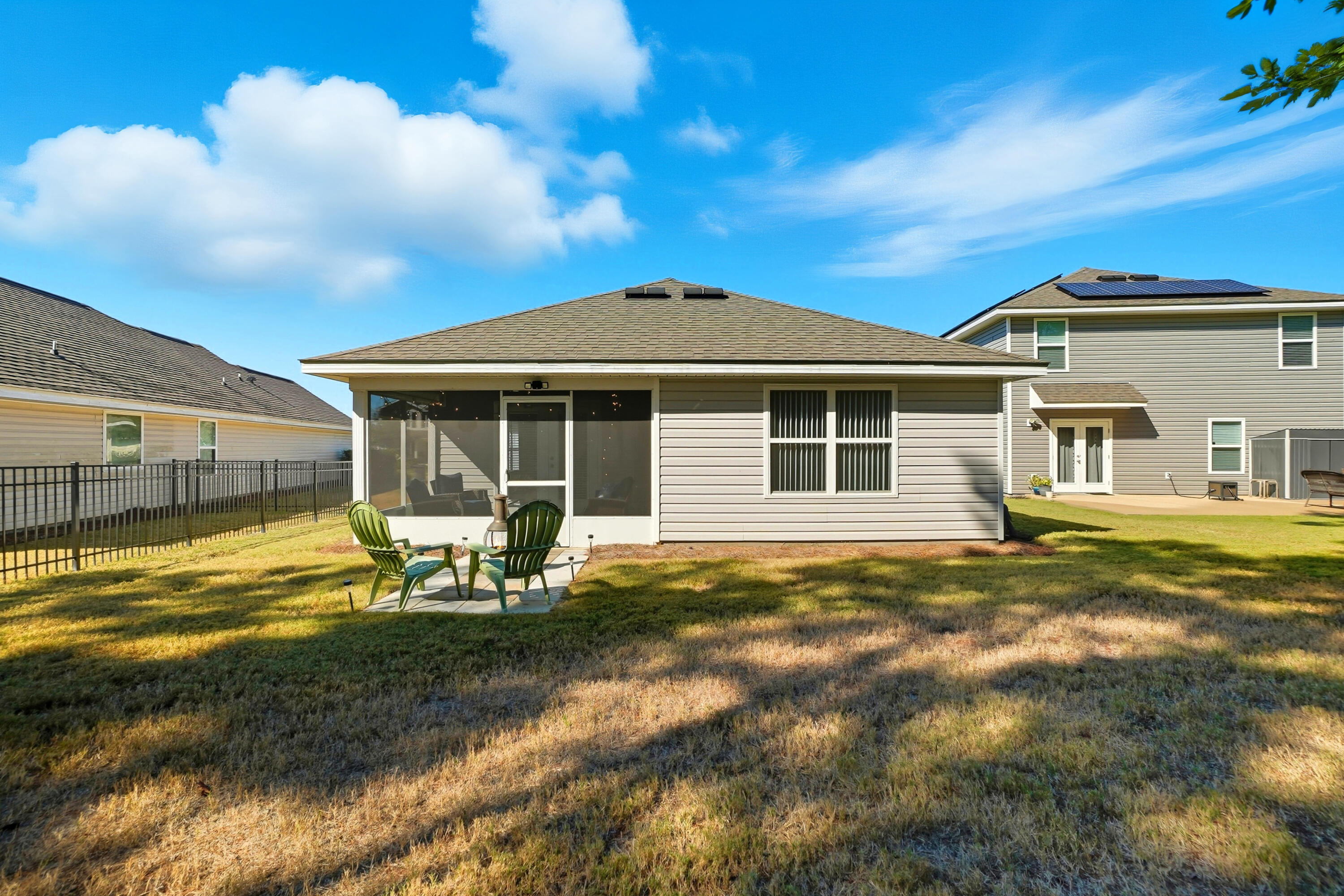 473 Earl Godwin Road Freeport, FL 32439 - Photo 17 of 29 a view of a house with backyard porch and sitting area