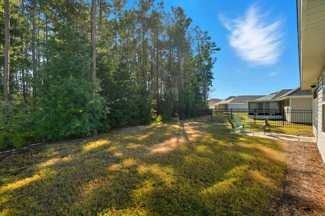 a view of a yard with swimming pool