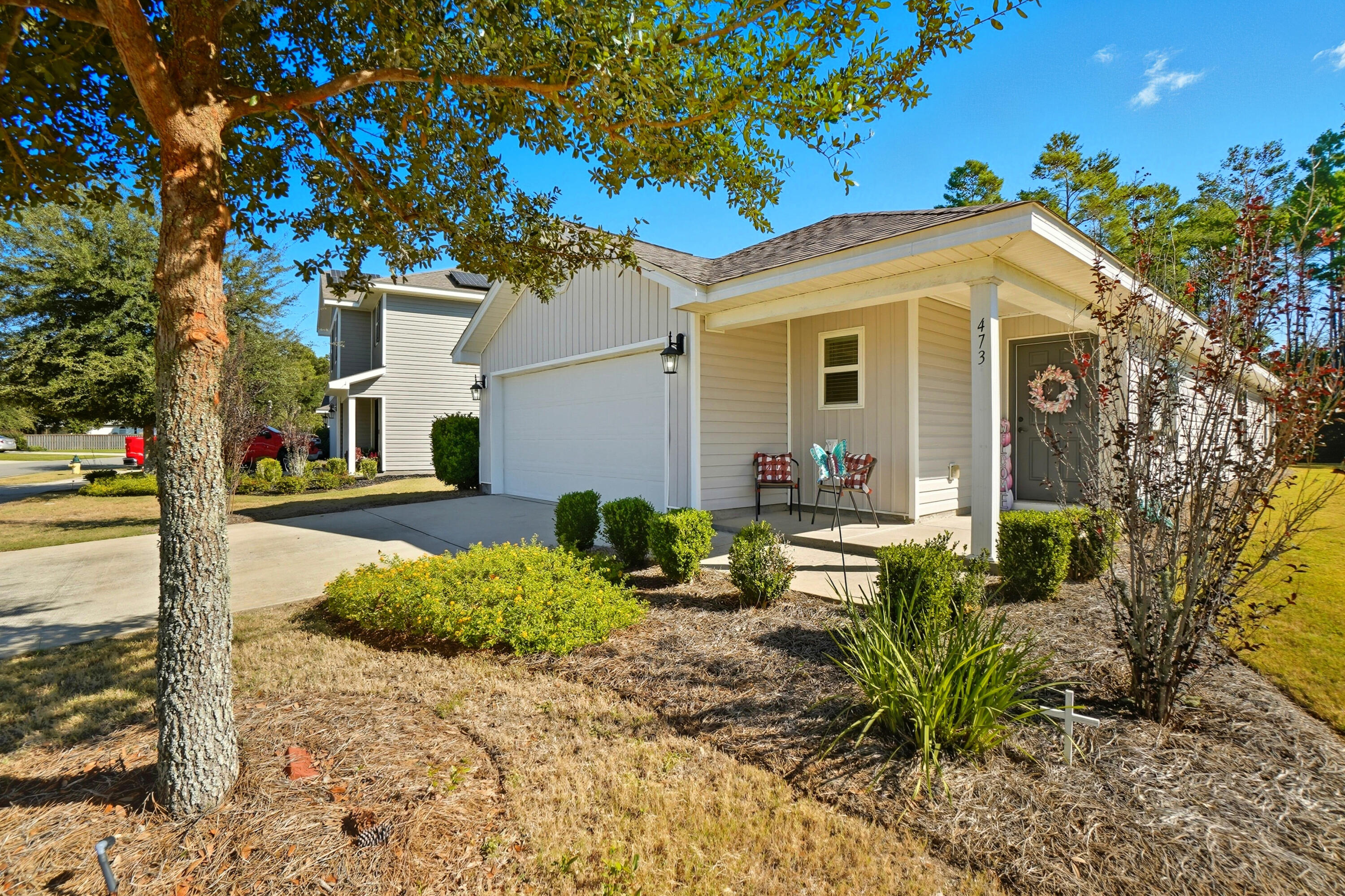 473 Earl Godwin Road Freeport, FL 32439 - Photo 2 of 29 a front view of a house with garden