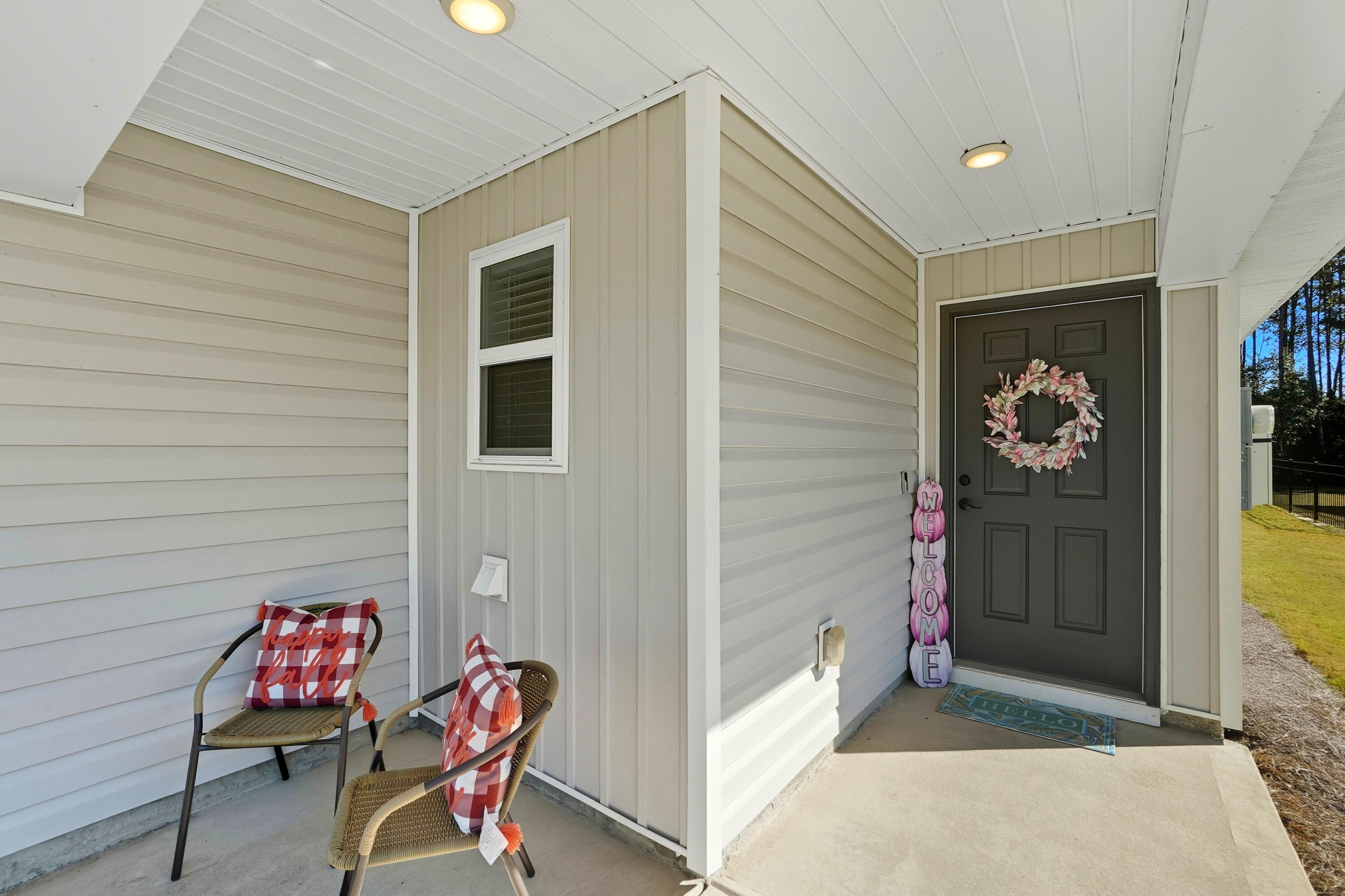 473 Earl Godwin Road Freeport, FL 32439 - Photo 3 of 29 a view of a door and chair in the patio