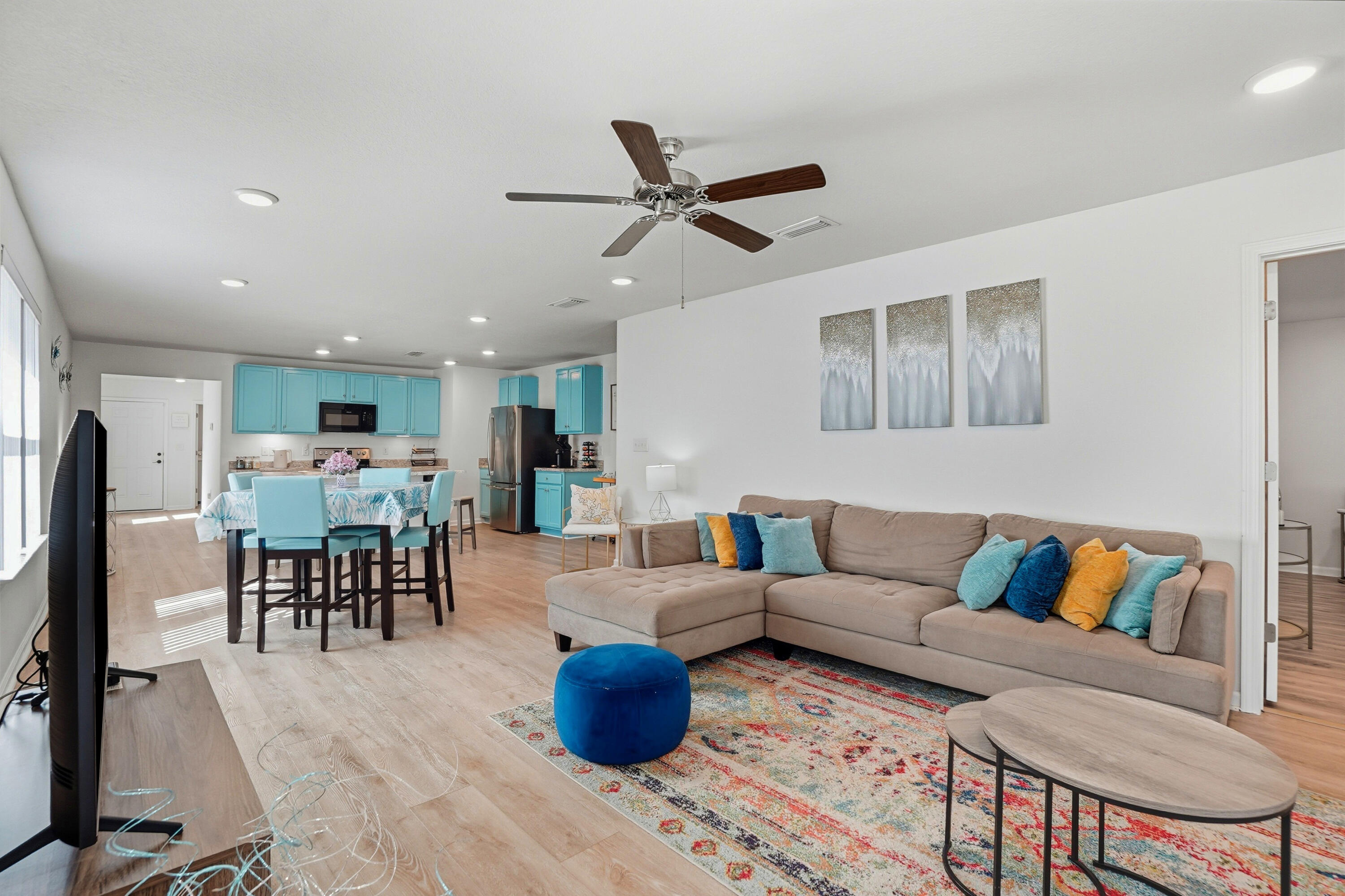 473 Earl Godwin Road Freeport, FL 32439 - Photo 4 of 29 a living room with furniture kitchen view and a dining table