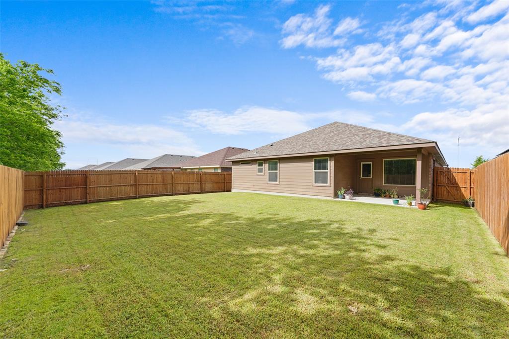 9020 Ridgeriver Way Fort Worth, TX 76131 - Photo 25 of 26 a view of a house with a backyard