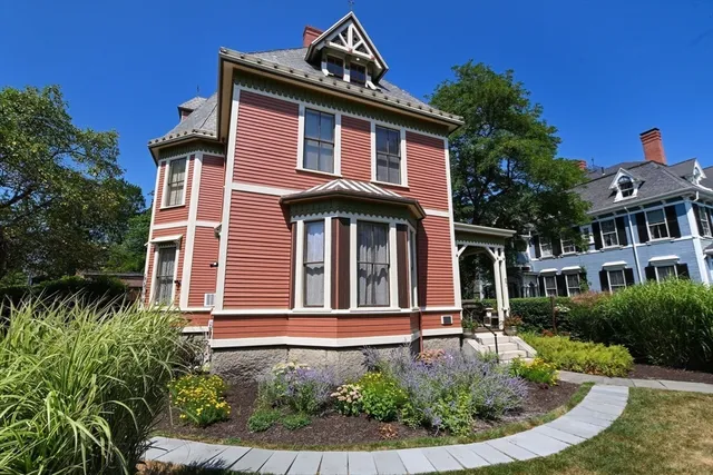 a front view of a house with garden