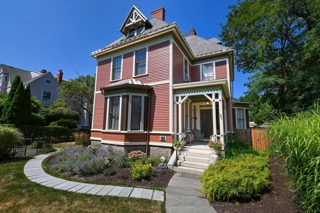 a front view of a house with garden