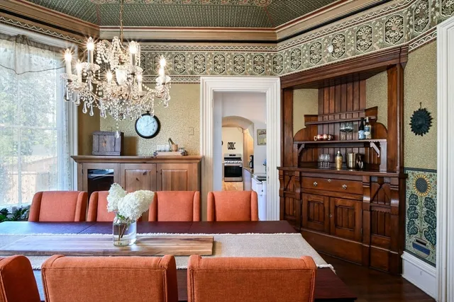 a kitchen view with table and chairs