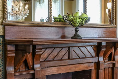 a vase of flowers sitting on a shelf